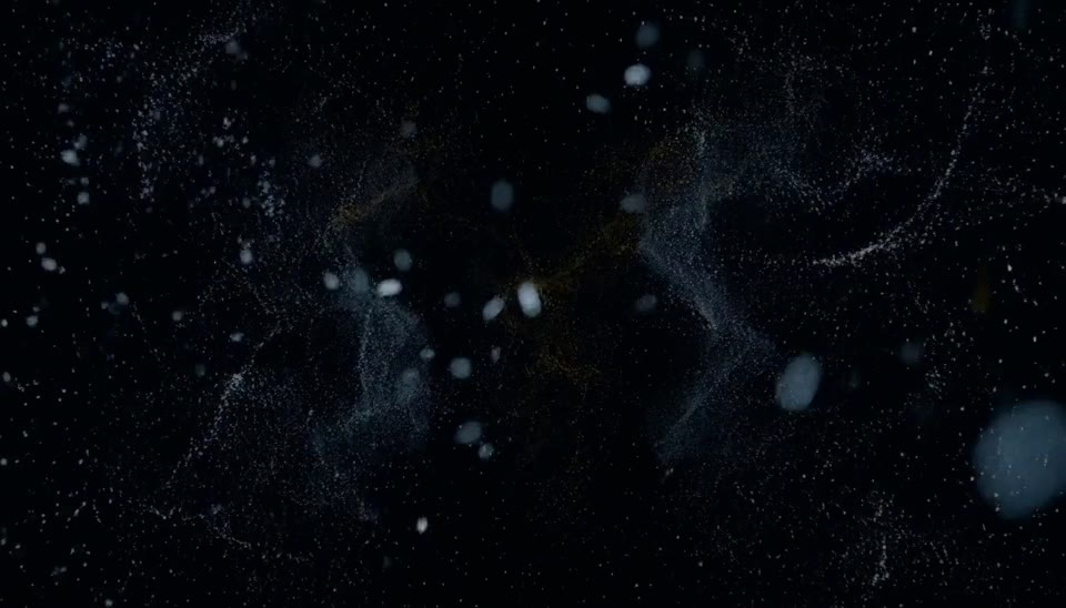 Frame at zero seconds: cold particle static on a dark void