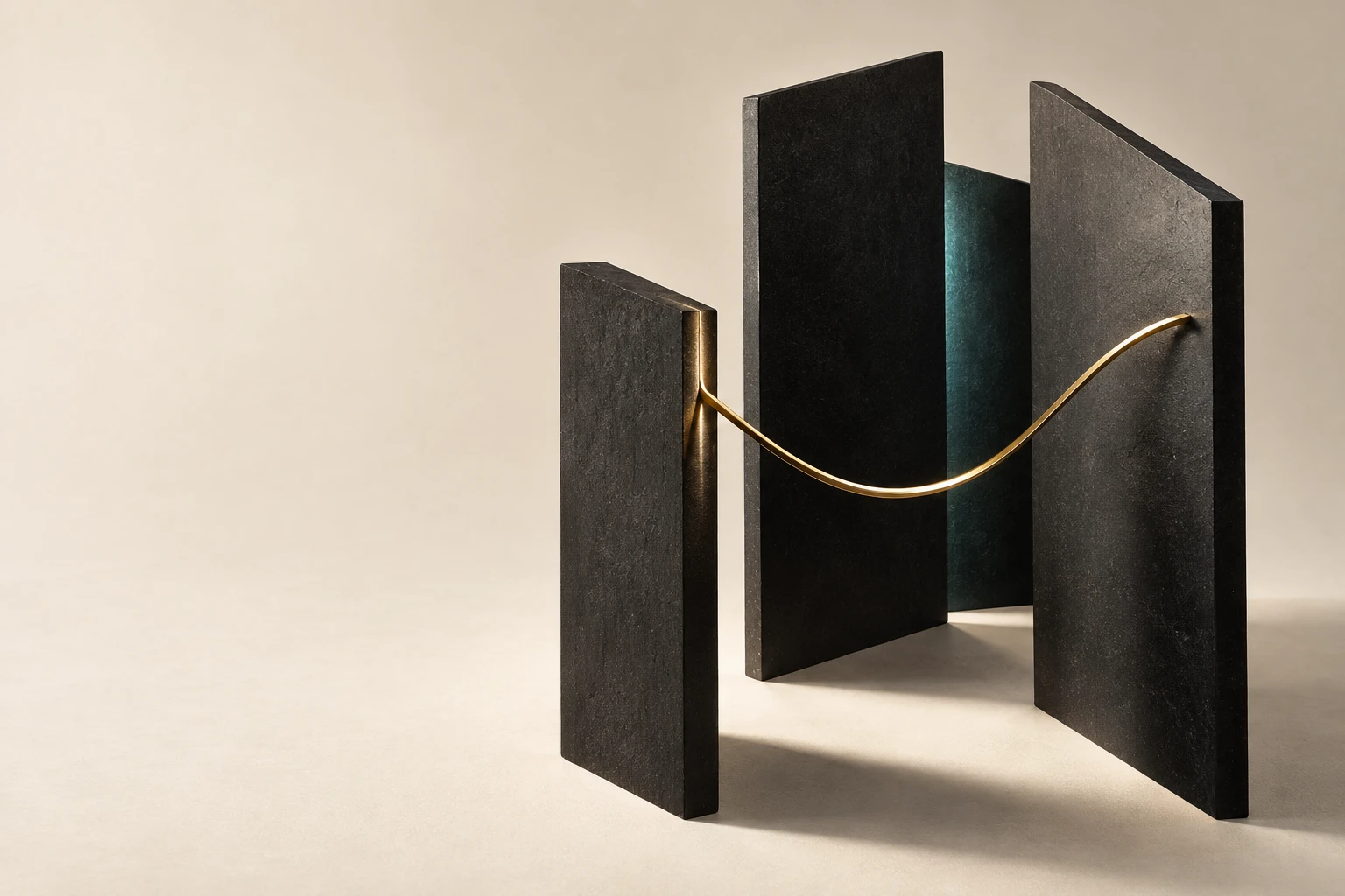 Charcoal sculptural panels and a fine gold line on a warm paper surface.